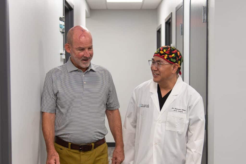 Dr. Chang and patient walking down the hallway together